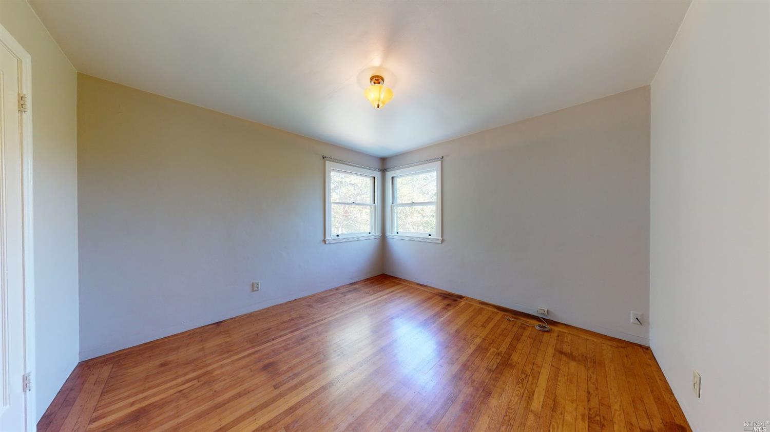 77 Homestead Boulevard Mill Valley, CA 94941 - Photo 7 of 56 a view of empty room with wooden floor and fan