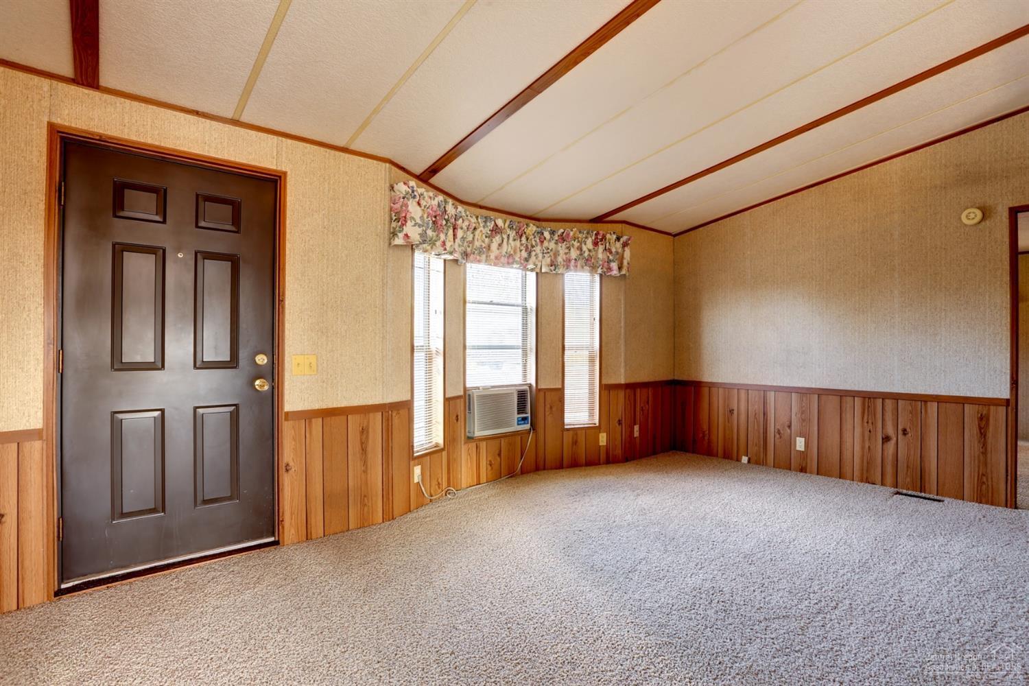 65040 Hunnell Road Bend, OR 97703 - Photo 2 of 25 a view of an empty room with a window