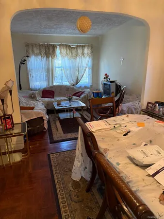 a dining room with furniture and window