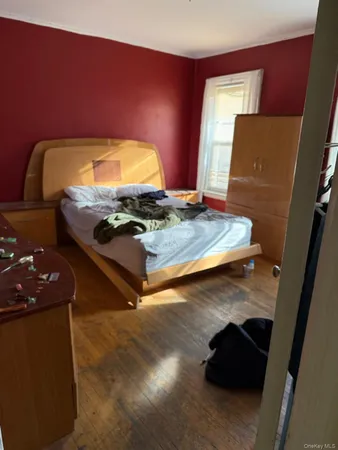 a bedroom with table and bed