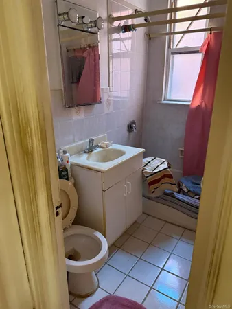 a bathroom with a toilet and a sink
