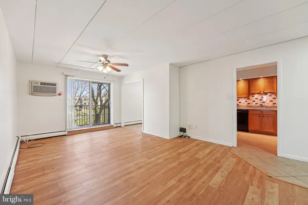 a view of an empty room with a window