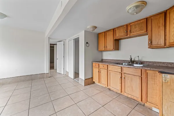 a kitchen with stainless steel appliances granite countertop a sink and cabinets