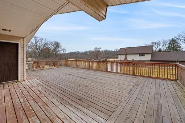 a view of balcony with wooden floor
