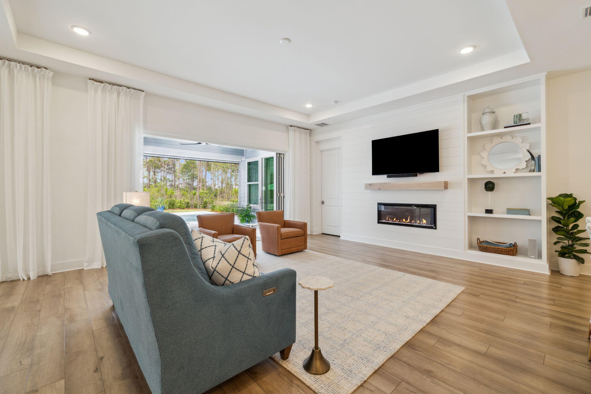 282 West Lafayette Rd Inlet Beach Inlet Beach, FL 32461 - Photo 11 of 40 a living room with furniture a flat screen tv and a fireplace