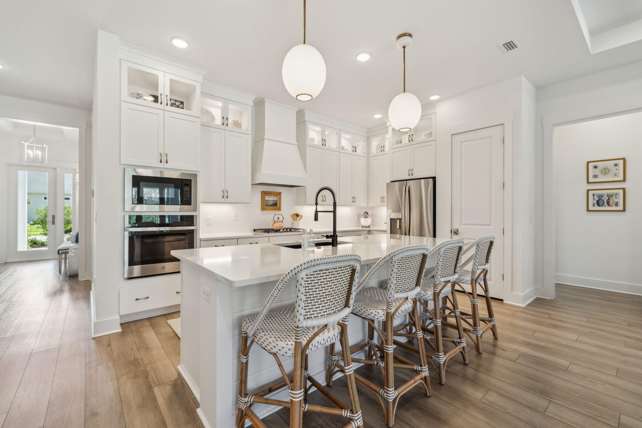 282 West Lafayette Rd Inlet Beach Inlet Beach, FL 32461 - Photo 13 of 40 a kitchen with stainless steel appliances kitchen island granite countertop a table chairs and a refrigerator