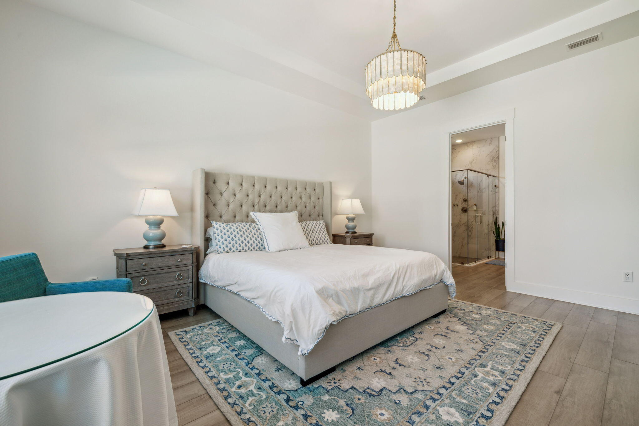 282 West Lafayette Rd Inlet Beach Inlet Beach, FL 32461 - Photo 18 of 40 a bedroom with a bed and a chandelier