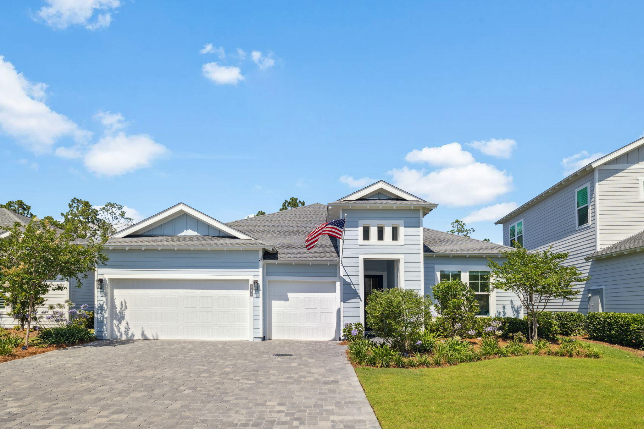 282 West Lafayette Rd Inlet Beach Inlet Beach, FL 32461 - Photo 5 of 40 a front view of a house with a yard and garage