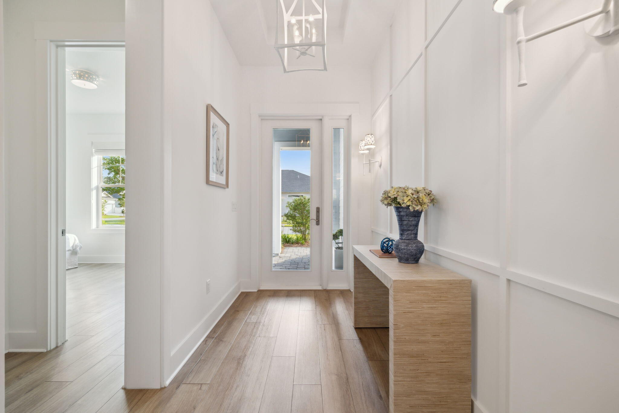 282 West Lafayette Rd Inlet Beach Inlet Beach, FL 32461 - Photo 7 of 40 a view of a hallway with wooden floor and a livingroom