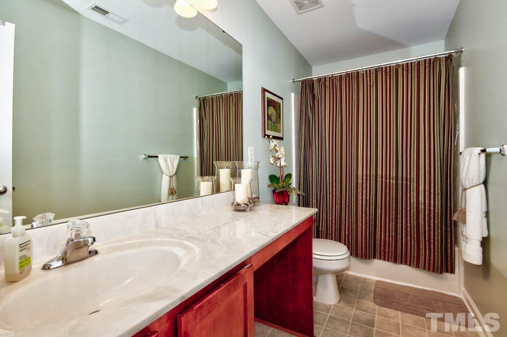 4225 Hopper Street Raleigh, NC 27616 - Photo 11 of 19 a bathroom with a sink and a mirror