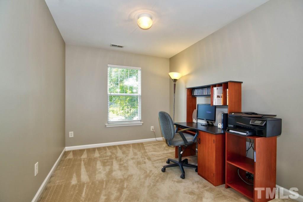 4225 Hopper Street Raleigh, NC 27616 - Photo 12 of 19 a view of a workspace with furniture and a window
