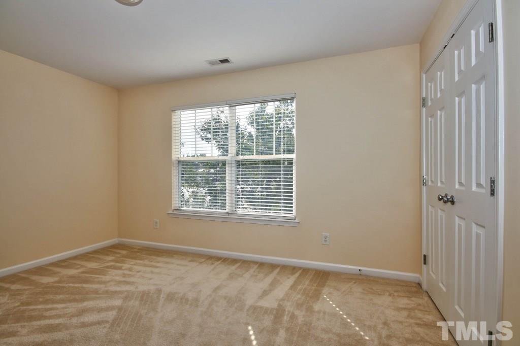 4225 Hopper Street Raleigh, NC 27616 - Photo 13 of 19 a view of an empty room with a window