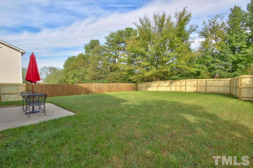 4225 Hopper Street Raleigh, NC 27616 - Photo 18 of 19 a view of backyard with swimming pool and seating