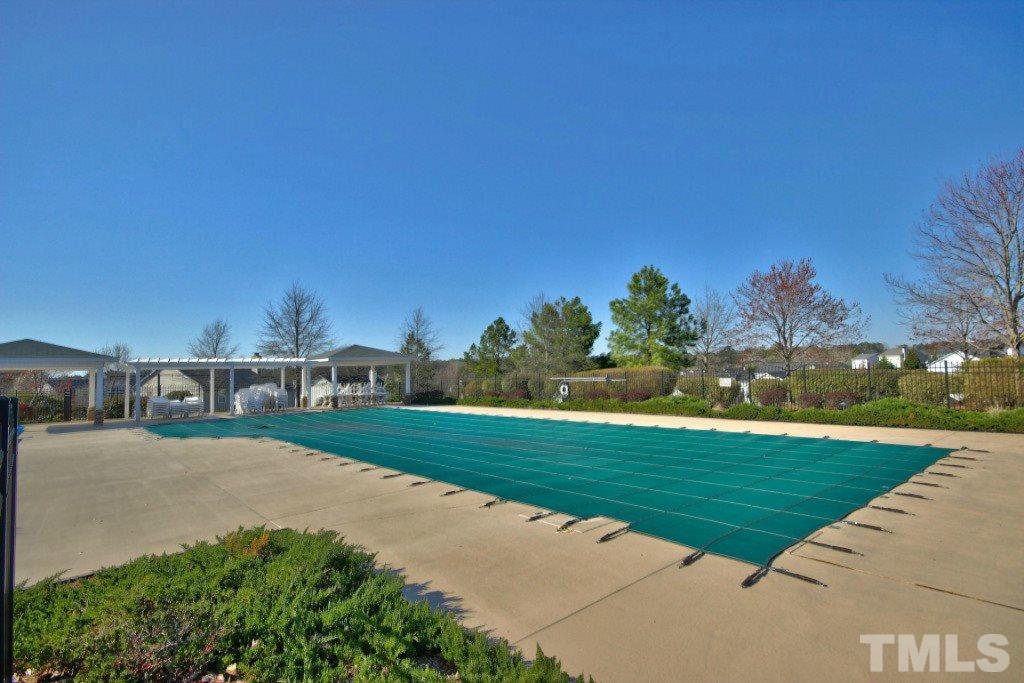 4225 Hopper Street Raleigh, NC 27616 - Photo 19 of 19 a view of a golf course with a lake