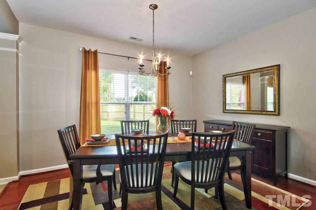 4225 Hopper Street Raleigh, NC 27616 - Photo 4 of 19 a view of a dining room with furniture window and outside view