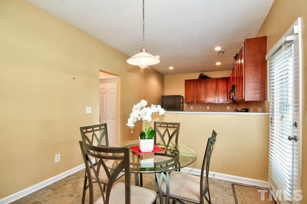 4225 Hopper Street Raleigh, NC 27616 - Photo 5 of 19 a view of a dining room with furniture and a chandelier
