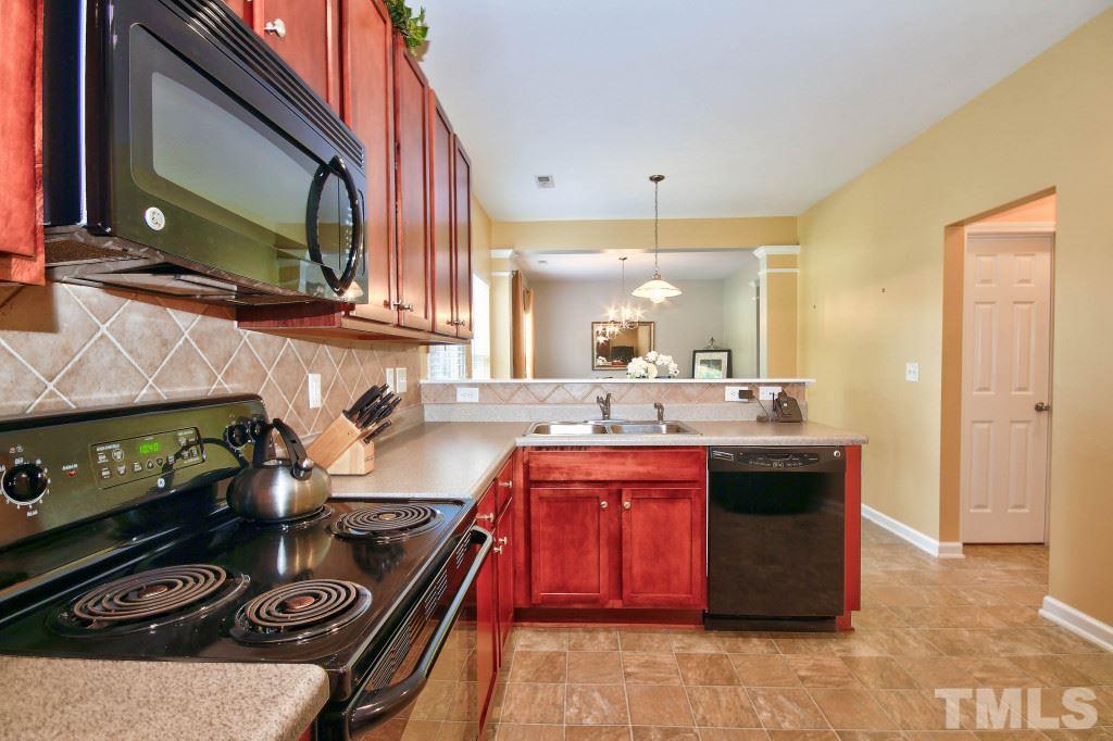 4225 Hopper Street Raleigh, NC 27616 - Photo 7 of 19 a kitchen with a stove and a sink