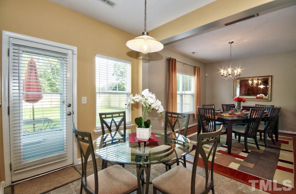4225 Hopper Street Raleigh, NC 27616 - Photo 8 of 19 a view of a dining room with furniture window and outside view
