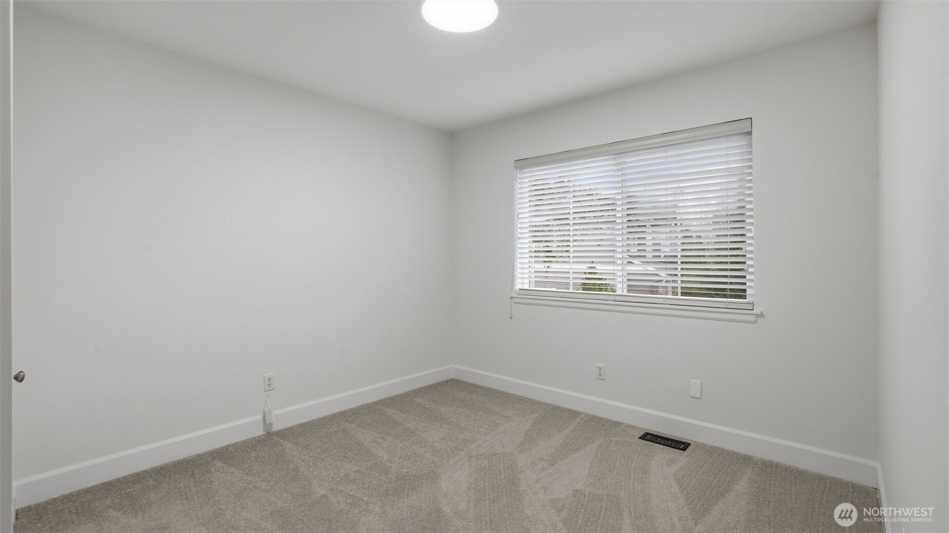 16102 Parkside Way Southeast Renton, WA 98058 - Photo 17 of 27 an empty room with a window