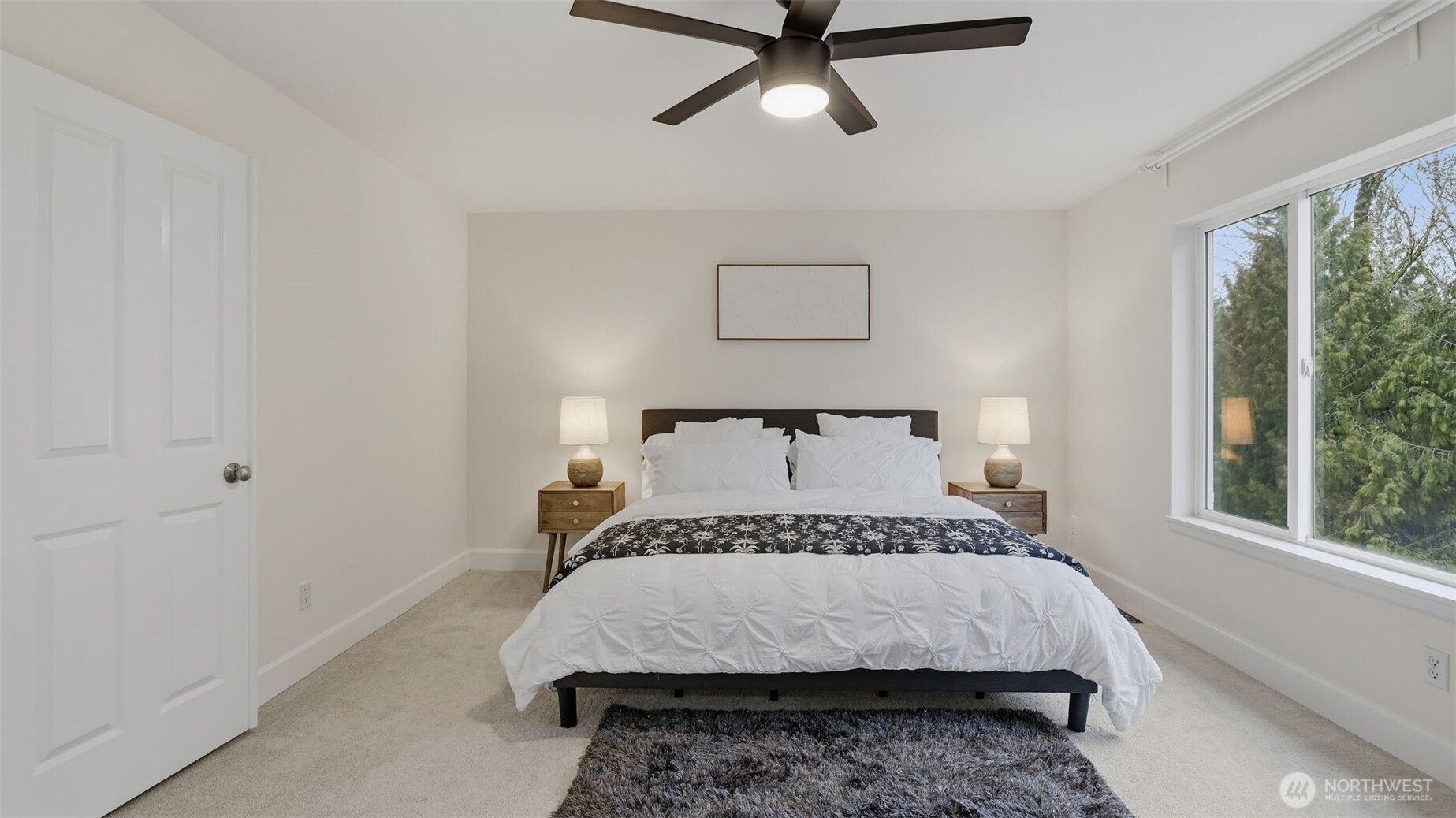 16102 Parkside Way Southeast Renton, WA 98058 - Photo 19 of 27 a bedroom with a large bed and a window
