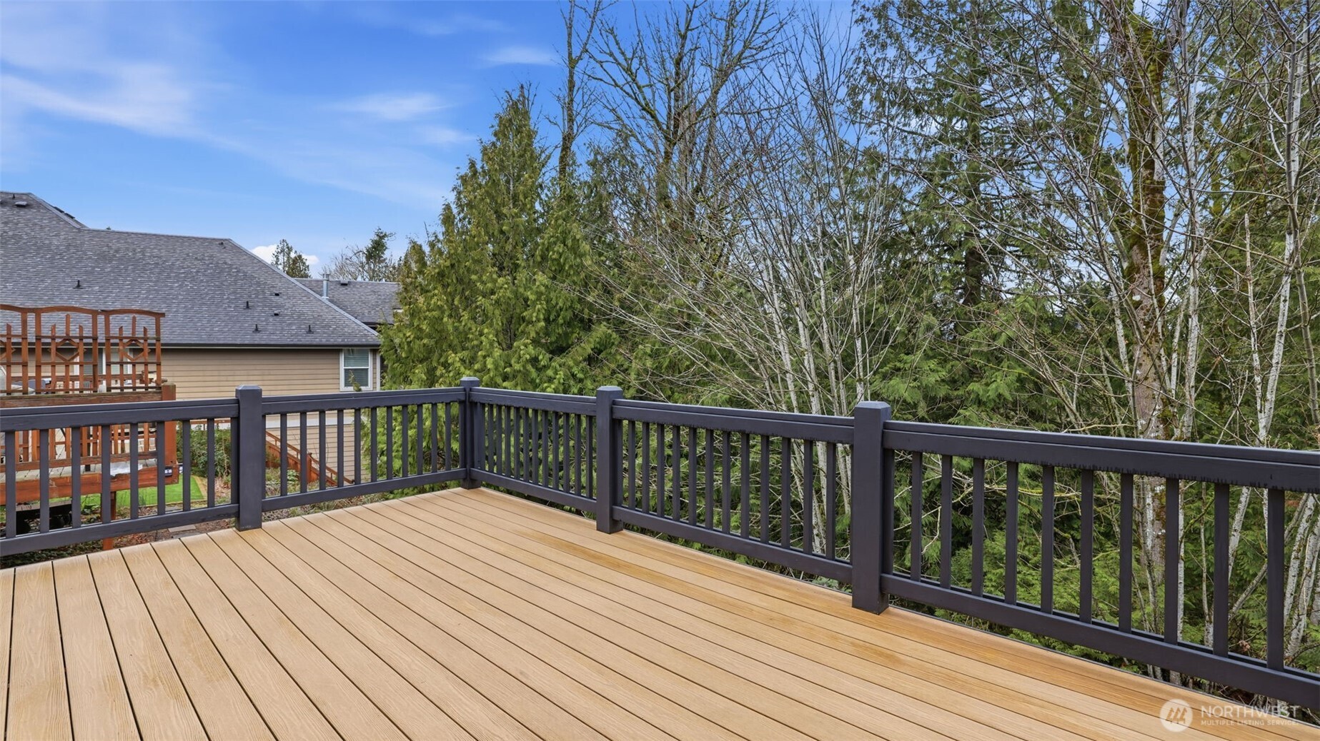 16102 Parkside Way Southeast Renton, WA 98058 - Photo 24 of 27 a balcony with wooden floor and fence