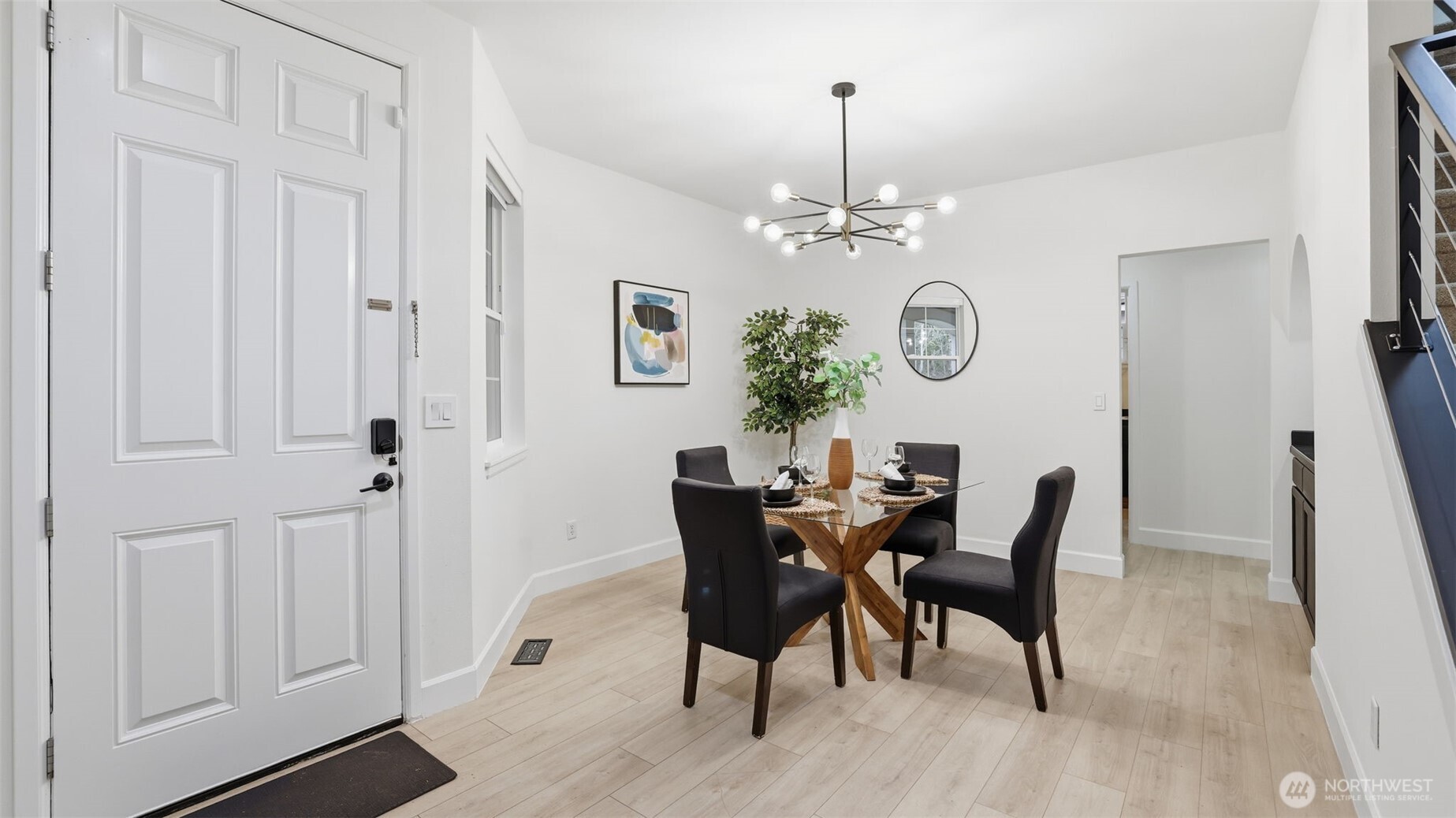 16102 Parkside Way Southeast Renton, WA 98058 - Photo 4 of 27 a view of a dining room with furniture window and wooden floor