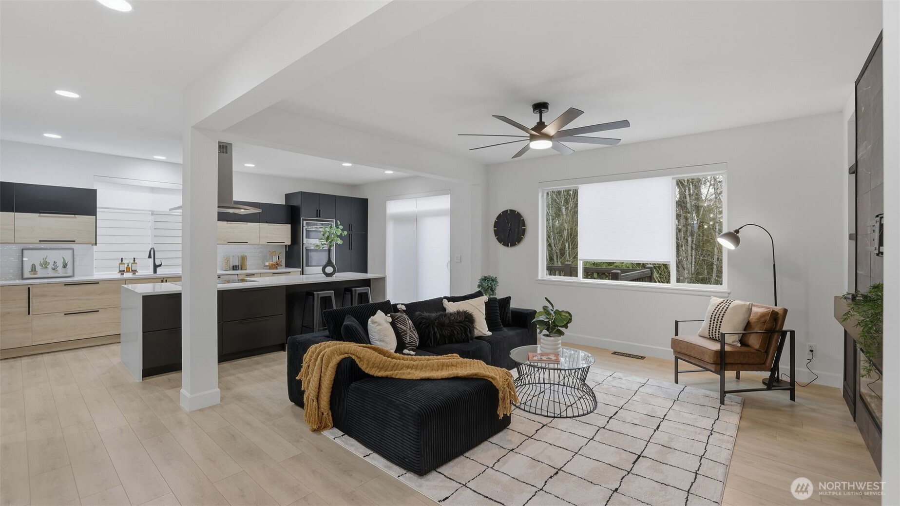 16102 Parkside Way Southeast Renton, WA 98058 - Photo 8 of 27 a living room with furniture and a large window