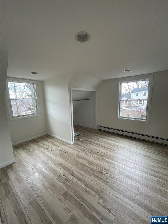 70 Suters Lane Wayne, NJ 07470 - Photo 14 of 22 an empty room with wooden floor and windows