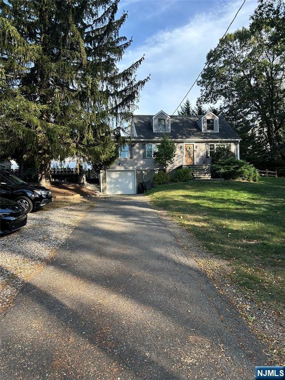 70 Suters Lane Wayne, NJ 07470 - Photo 20 of 22 a front view of a house with a garden