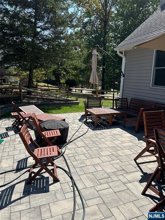 70 Suters Lane Wayne, NJ 07470 - Photo 22 of 22 a view of swimming pool with chairs and tables