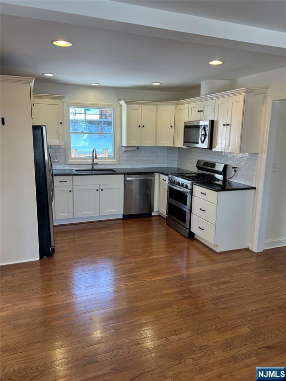 70 Suters Lane Wayne, NJ 07470 - Photo 3 of 22 a large kitchen with stainless steel appliances granite countertop a stove a sink dishwasher and a refrigerator