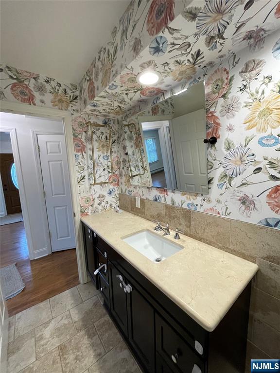 70 Suters Lane Wayne, NJ 07470 - Photo 10 of 22 a bathroom with a sink double vanity and a mirror