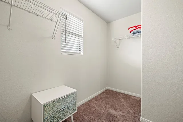 a utility room with shower and window
