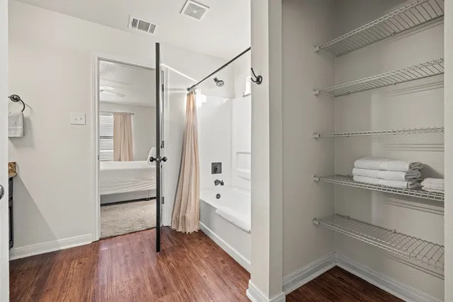 a bathroom with a shower and a sink
