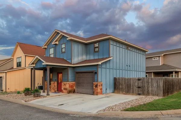 a front view of a house with yard