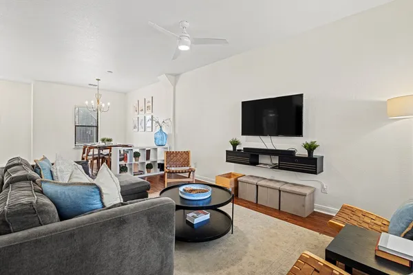 a living room with furniture and a flat screen tv