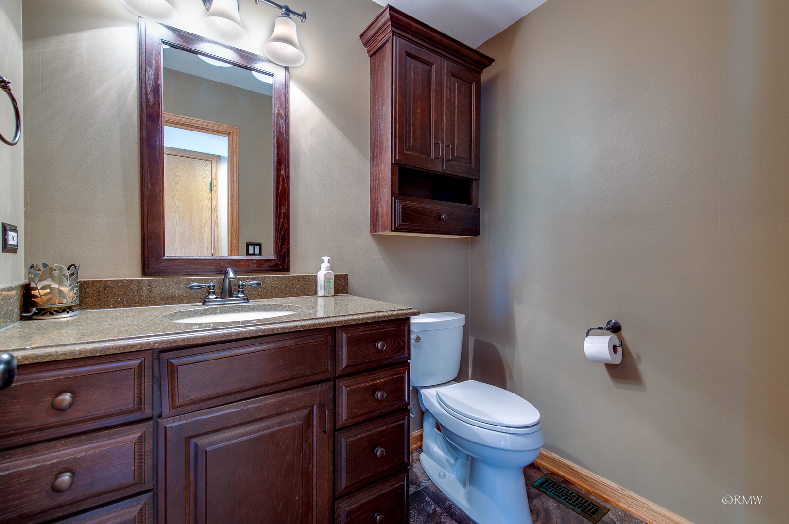1550 Squire Lane Addison, IL 60101 - Photo 19 of 39 a bathroom with a toilet a sink and mirror