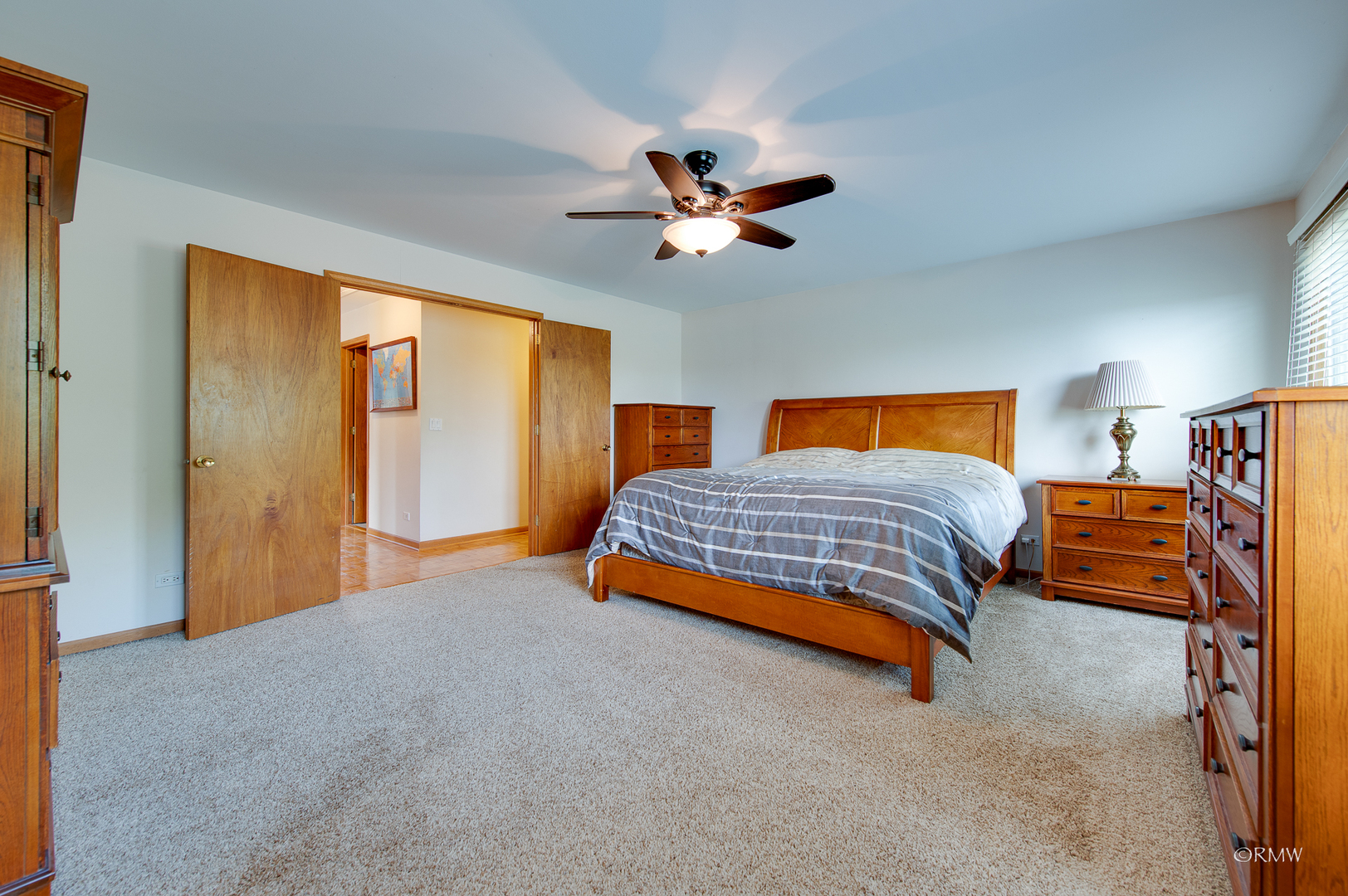 1550 Squire Lane Addison, IL 60101 - Photo 25 of 39 a bedroom with a bed and a chandelier