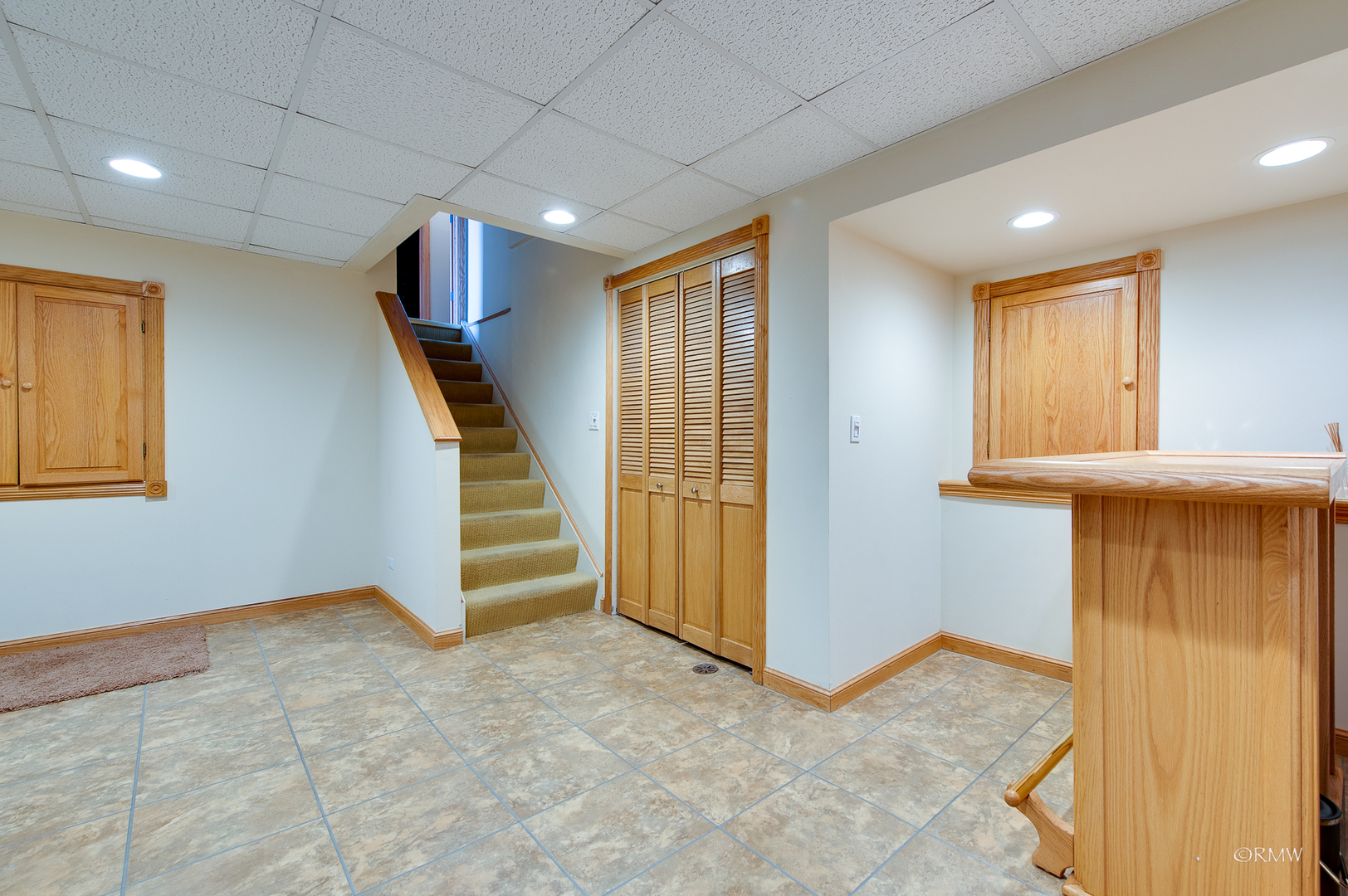 1550 Squire Lane Addison, IL 60101 - Photo 28 of 39 a view of an empty room with stairs and a window