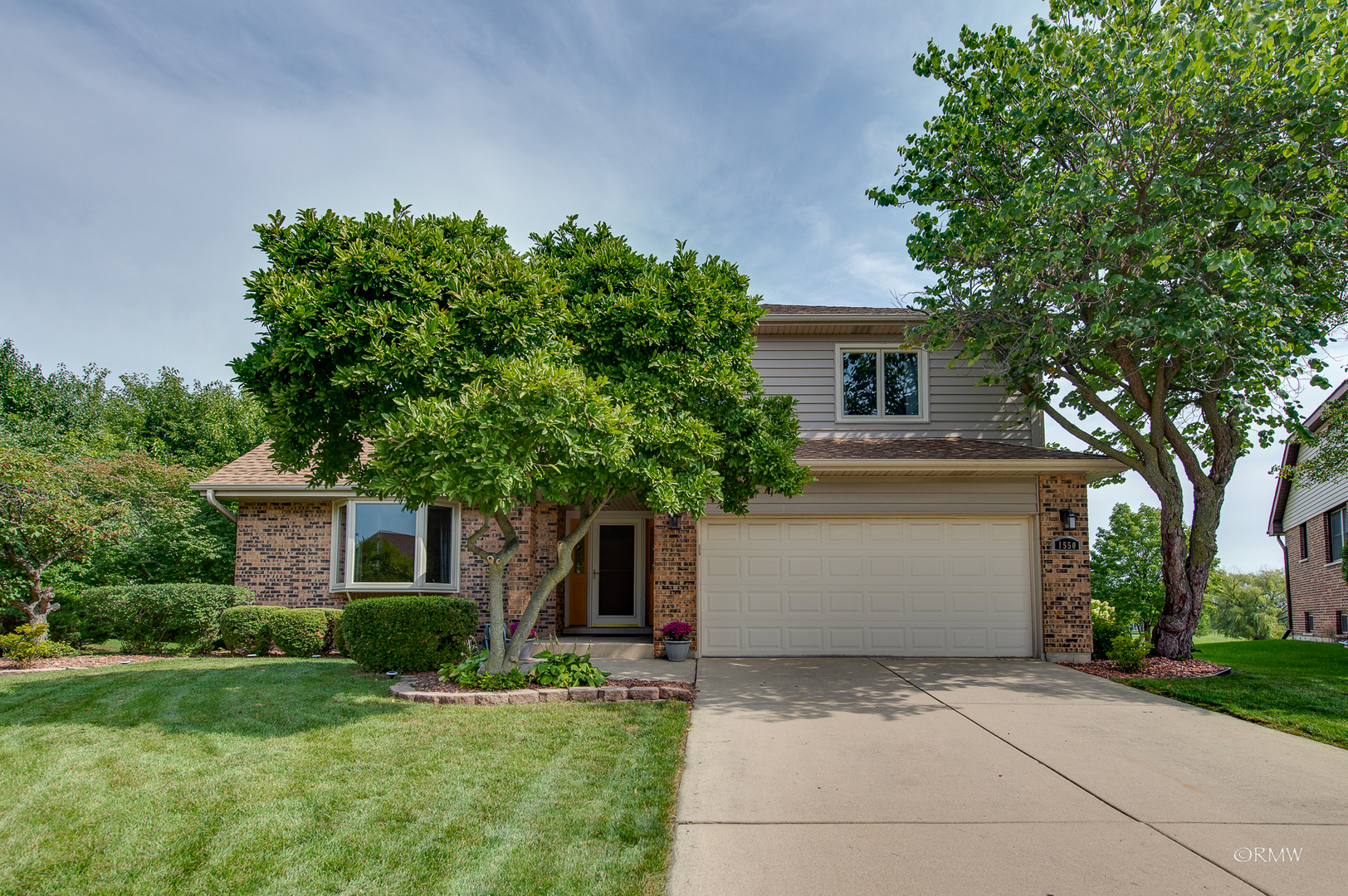 1550 Squire Lane Addison, IL 60101 - Photo 6 of 39 a front view of a house with a yard and a garage