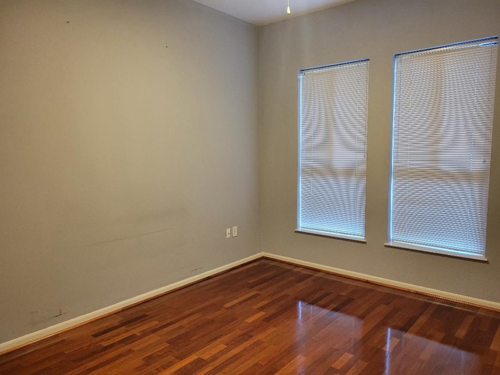 3505 Sage Road, Unit 211 Houston, TX 77056 - Photo 20 of 25 a view of a small space with wooden floor and a window