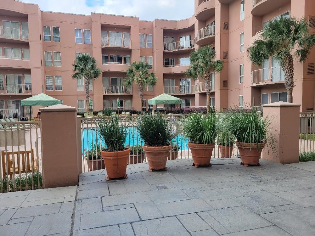3505 Sage Road, Unit 211 Houston, TX 77056 - Photo 5 of 25 a view of a patio with plants and chairs