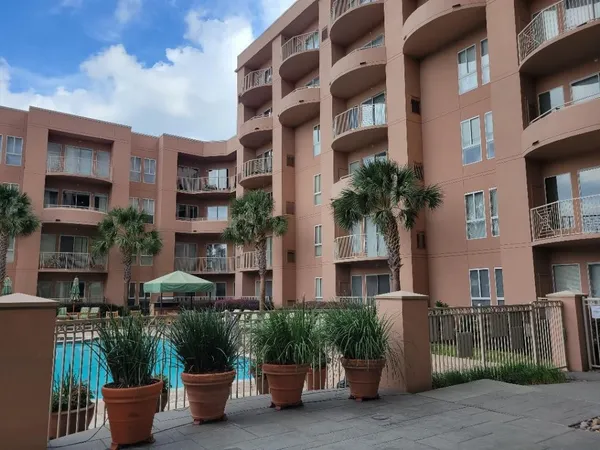 a view of a building with potted plants