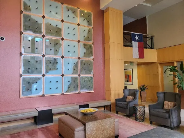 a view of hall way with furniture