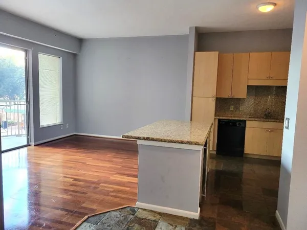 a kitchen with a stove and a refrigerator