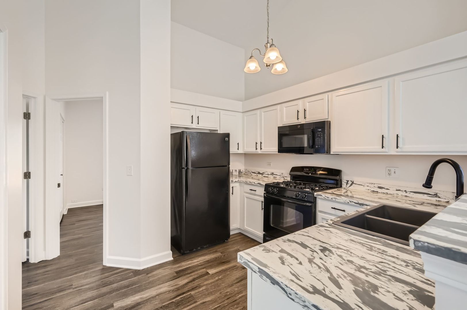 3019 Hoffman Street Plano, IL 60545 - Photo 5 of 10 a kitchen with stainless steel appliances granite countertop a refrigerator a stove a sink and a microwave