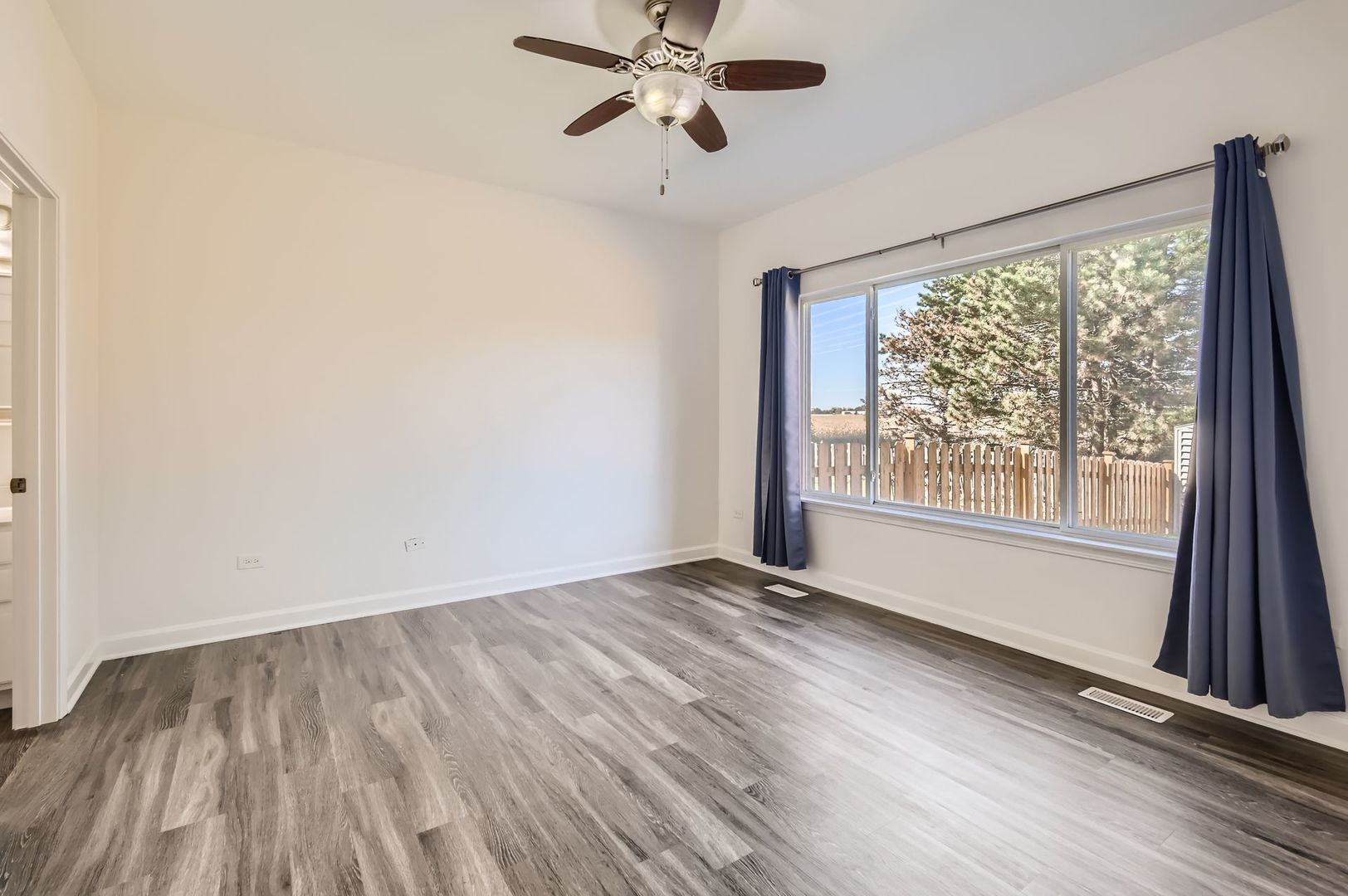 3019 Hoffman Street Plano, IL 60545 - Photo 6 of 10 a view of an empty room with a window