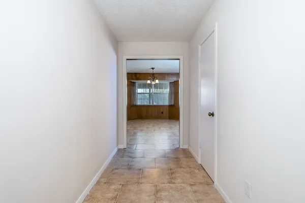 a view of a hallway with a white walls