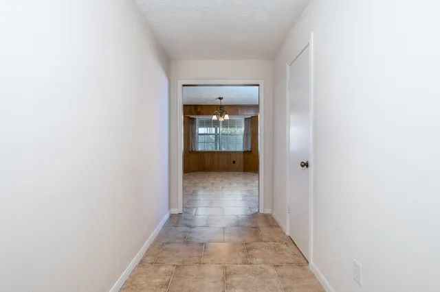 a view of a hallway with a white walls