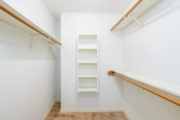 a view of an empty walk in closet